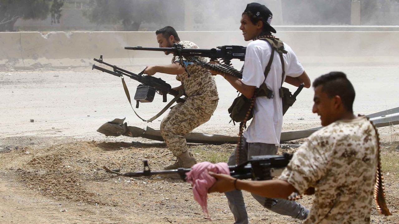 Fighters loyal to the internationally-recognised Libyan government clashes with forces loyal to strongman Khalifa Haftar south of Tripoli in June 2019.