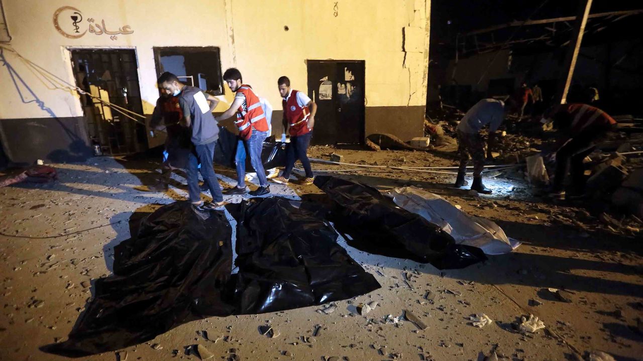 Emergency workers recover bodies after an airstrike at Tajoura Detention Center, east of Tripoli on early July 3, 2019.