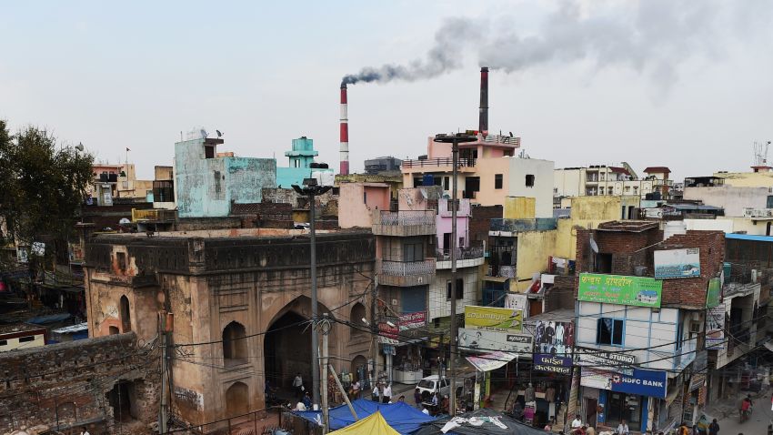 In this photograph taken on April 6, 2015, smoke billows from two smoke stacks at the coal-based Badarpur Thermal Station in New Delhi. A study by the Centre of Science and Environment in India found the plant which produces 705 MW (Megawatts) is one of the country's most polluting and inefficient power plants. Authorities insist they must focus on meeting the growing needs of its 1.25 billion people, 300 million of whom lack access to electricity. In its action plan for the Paris COP21 meet, India pledges to reduce its carbon intensity -- a measure of a country's emissions relative to its economic output -- by 35 percent by 2030, rather than an absolute cut in emissions. 
Globally, India is the third largest carbon-emitting country -- though its per capita emissions are only one third of the international average -- according to the World Resources Institute.  AFP PHOTO / MONEY SHARMA 