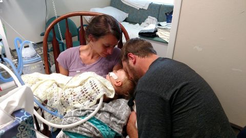 Jenny and Adam Bennett comfort their son, Jackson, while he was on life support at a Houston hospital in 2016. 