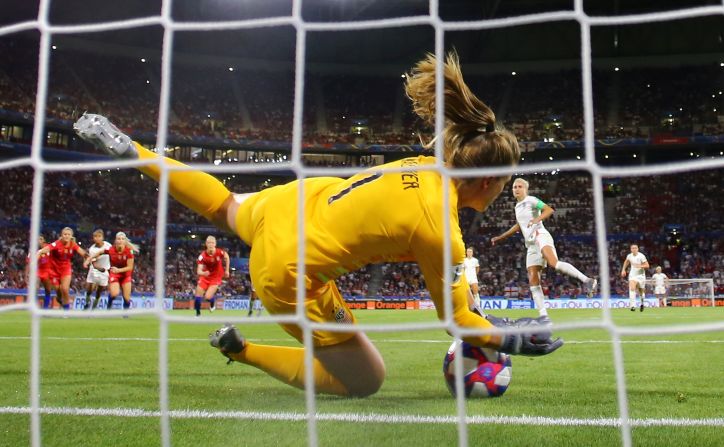 US goalkeeper Alyssa Naeher <a href="index.php?page=&url=https%3A%2F%2Fwww.cnn.com%2F2019%2F07%2F02%2Fus%2Falyssa-naeher-uswnt-trnd%2Findex.html" target="_blank">saves a penalty</a> by England's Steph Houghton late in the semifinal. The goal preserved the Americans' 2-1 lead.