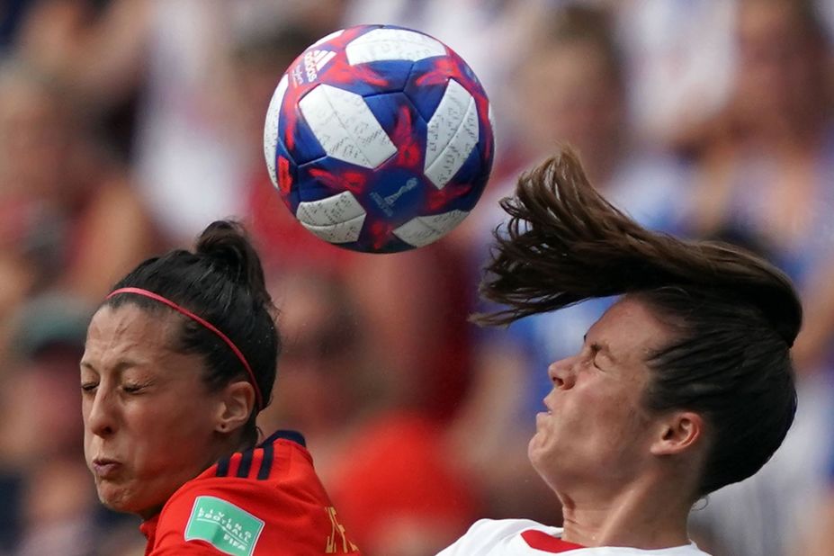 Spanish forward Jennifer Hermoso and US defender Kelley O'Hara compete for a header.