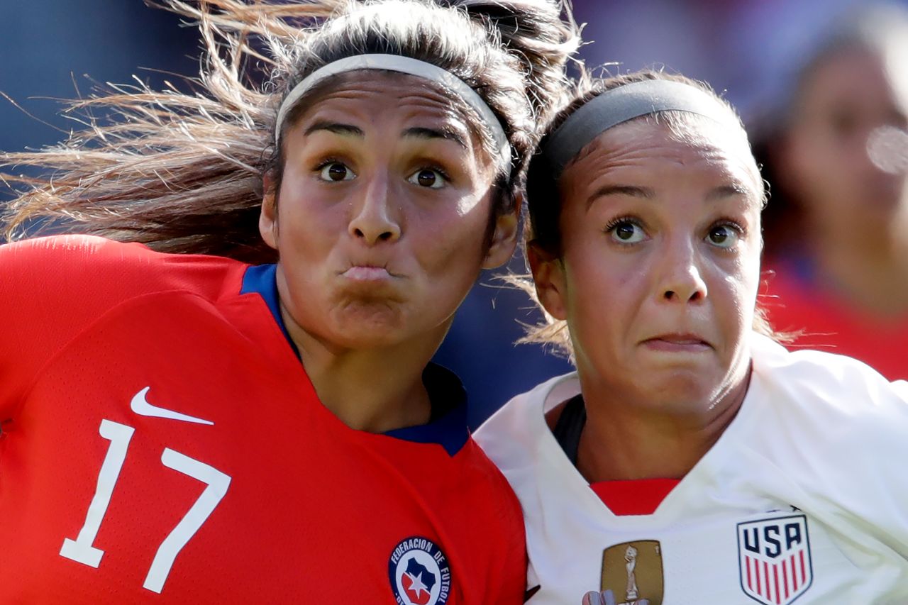 Chile's Javiera Tora, left, and US midfielder Mallory Pugh focus on the ball.