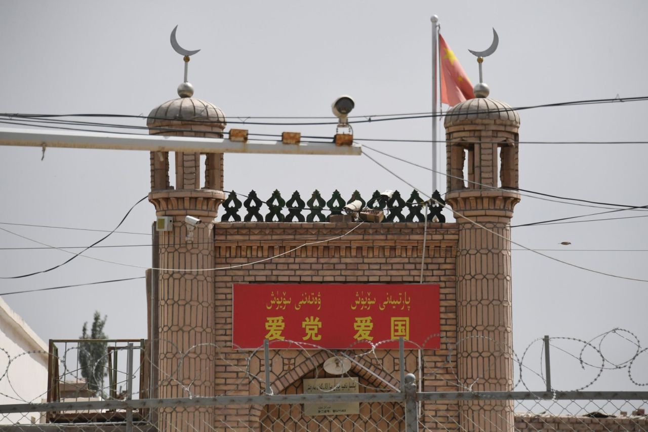 The Jieleixi No.13 village mosque in Yangisar, south of Kashgar, in China's western Xinjiang region on June 4, with a banner saying "Love party, love country."