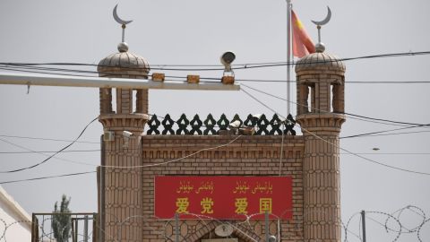 The Jieleixi No.13 village mosque in Yangisar, south of Kashgar, in China's western Xinjiang region on June 4, with a banner saying "Love party, love country."