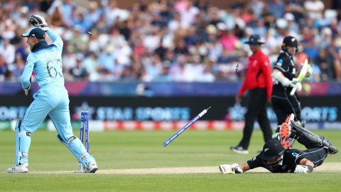 Ross Taylor of New Zealand is run out as Jos Buttler breaks the stumps after a throw from Adil Rashid.