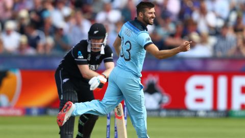 Mark Wood of England celebrates bowling Jimmy Neesham of New Zealand.