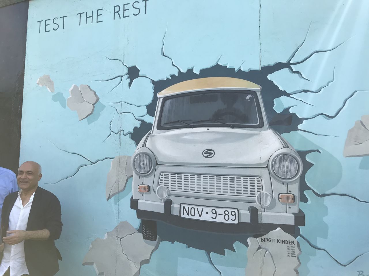 Alavi helped convince an East German artist to paint a now-famous image of her car driving through oppression.