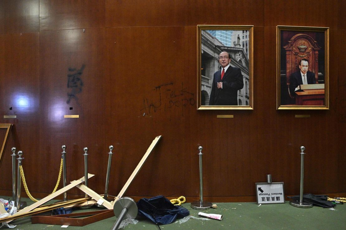 Damaged paintings are seen during a media tour of the Legislative Council in Hong Kong.