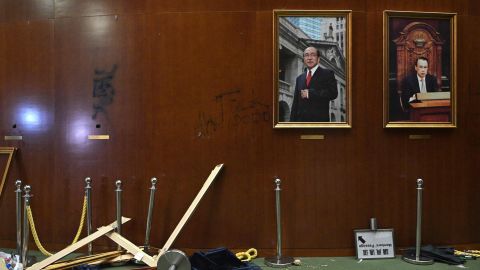 Damaged paintings are seen during a media tour of the Legislative Council in Hong Kong.