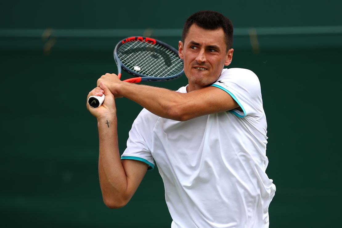 Tomic plays a backhand in his first round match against Jo-Wilfred Tsonga.