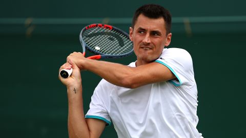 Tomic plays a backhand in his first round match against Jo-Wilfred Tsonga.