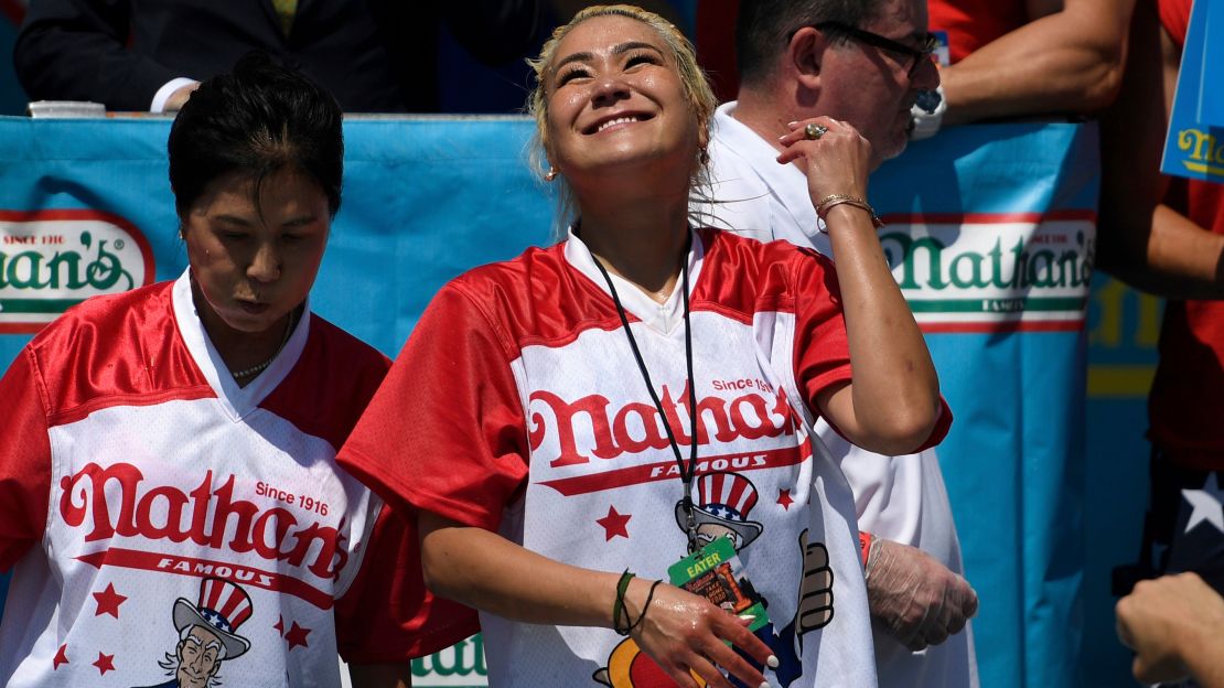 Miki Sudo, right, ate 31 hot dogs to win the women's competition. (AP Photo/Sarah Stier)