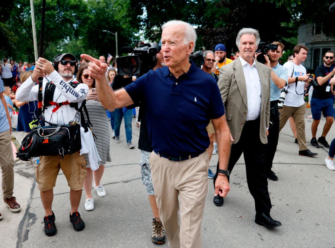 Former vice president and Democratic presidential candidate Joe Biden greets local residents while walking in the Independence Fourth of July parade, Thursday, July 4, 2019, in Independence, Iowa. (AP Photo/Charlie Neibergall)