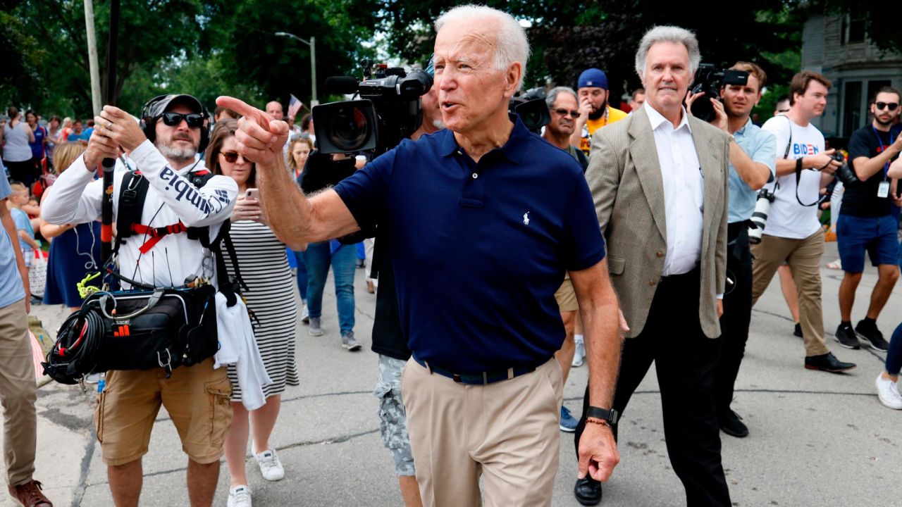 Former vice president and Democratic presidential candidate Joe Biden greets local residents while walking in the Independence Fourth of July parade, Thursday, July 4, 2019, in Independence, Iowa. (AP Photo/Charlie Neibergall)