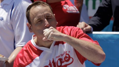 Joey Chestnut, who won the men's competition, wolfed down 71 hot dogs on Thursday. (Photo by Kena Betancur/Getty Images)