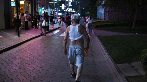 A man sports a Beijing bikini as he walks outside a shopping mall in Beijing on June 28, 2019. 