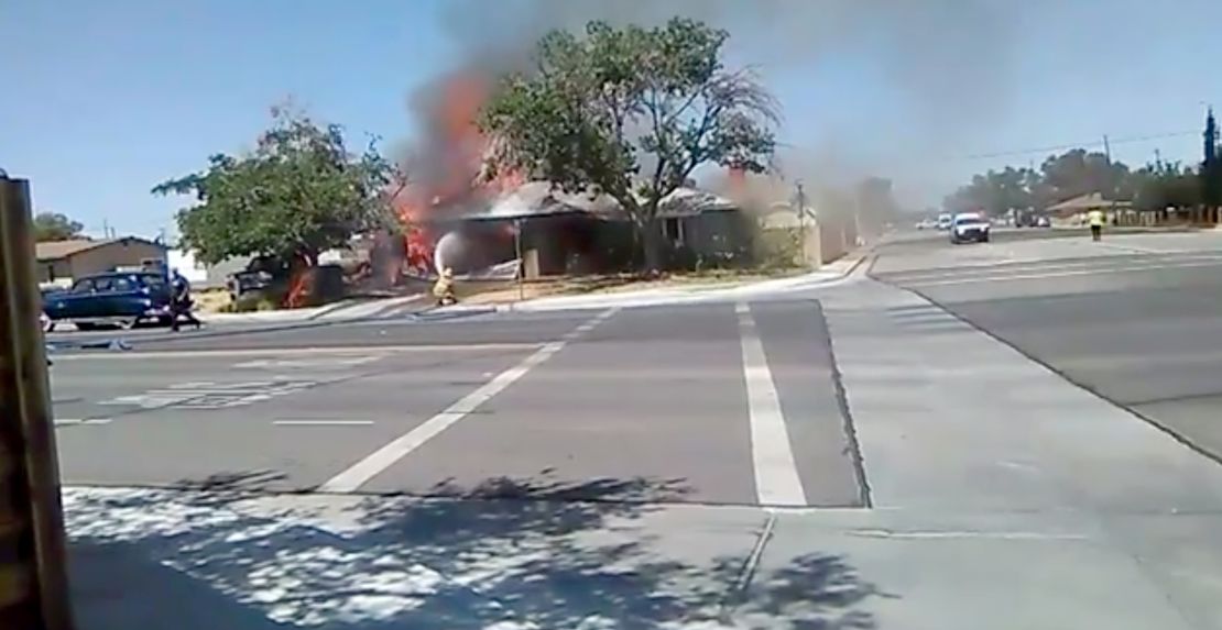 Firefighters battling a house fire in Ridgecrest, California.