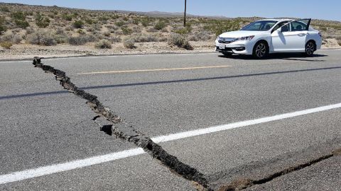 A crack in the road is seen near Ridgecrest , California, on Thursday, July 4, after an earthquake in the area. 