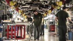 Employees work underneath Jaguar automobiles on the final assembly line at Tata Motors Ltd.'s Jaguar assembly plant in Castle Bromwich, U.K., on Thursday, March 16, 2017. Jaguar Land Rover Chief Executive Officer Ralf Speth backed Nissan Motor Co.'s calls for extra funding for car-parts makers in the wake of last years Brexit vote, while cautioning that there must be "fair play" for all U.K. automakers. Photographer: Simon Dawson/Bloomberg via Getty Images