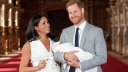 WINDSOR, ENGLAND - MAY 08: Prince Harry, Duke of Sussex and Meghan, Duchess of Sussex, pose with their newborn son Archie Harrison Mountbatten-Windsor during a photocall in St George's Hall at Windsor Castle on May 8, 2019 in Windsor, England. The Duchess of Sussex gave birth at 05:26 on Monday 06 May, 2019. (Photo by Dominic Lipinski - WPA Pool/Getty Images)