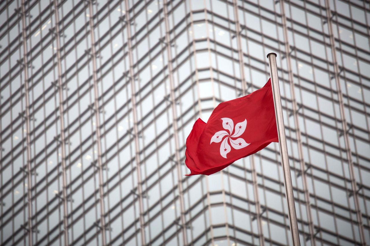 The Hong Kong flag flutters outside the Hong Kong Court of Final Appeal building.