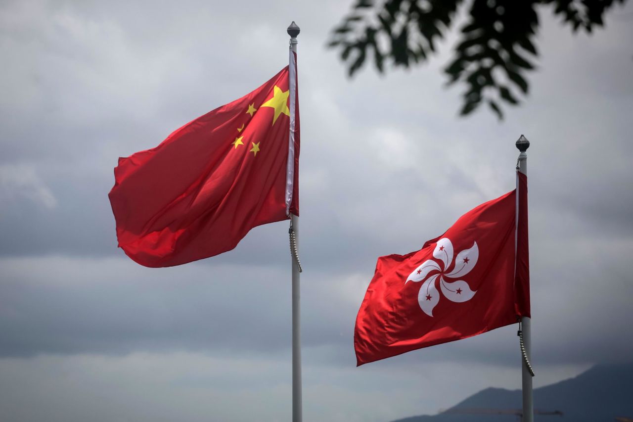 The China's national flag pictured beside that of Hong Kong.