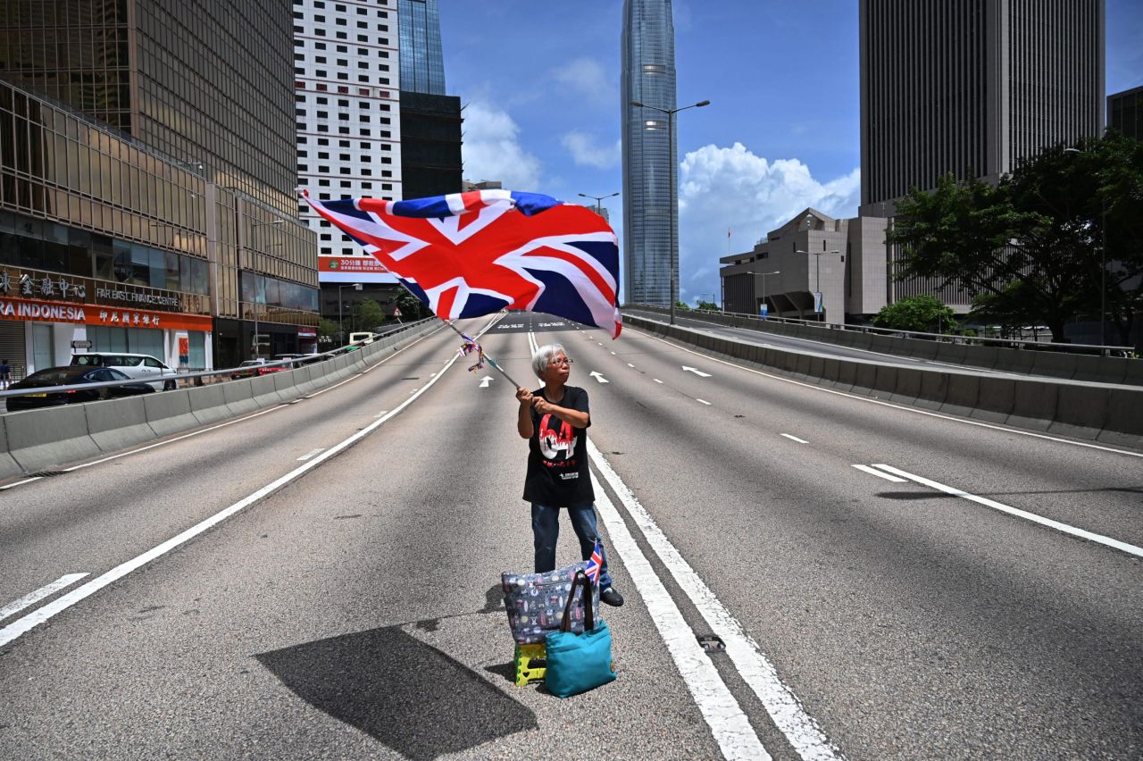 A protester waves a British flag while during protests in June 2019. 