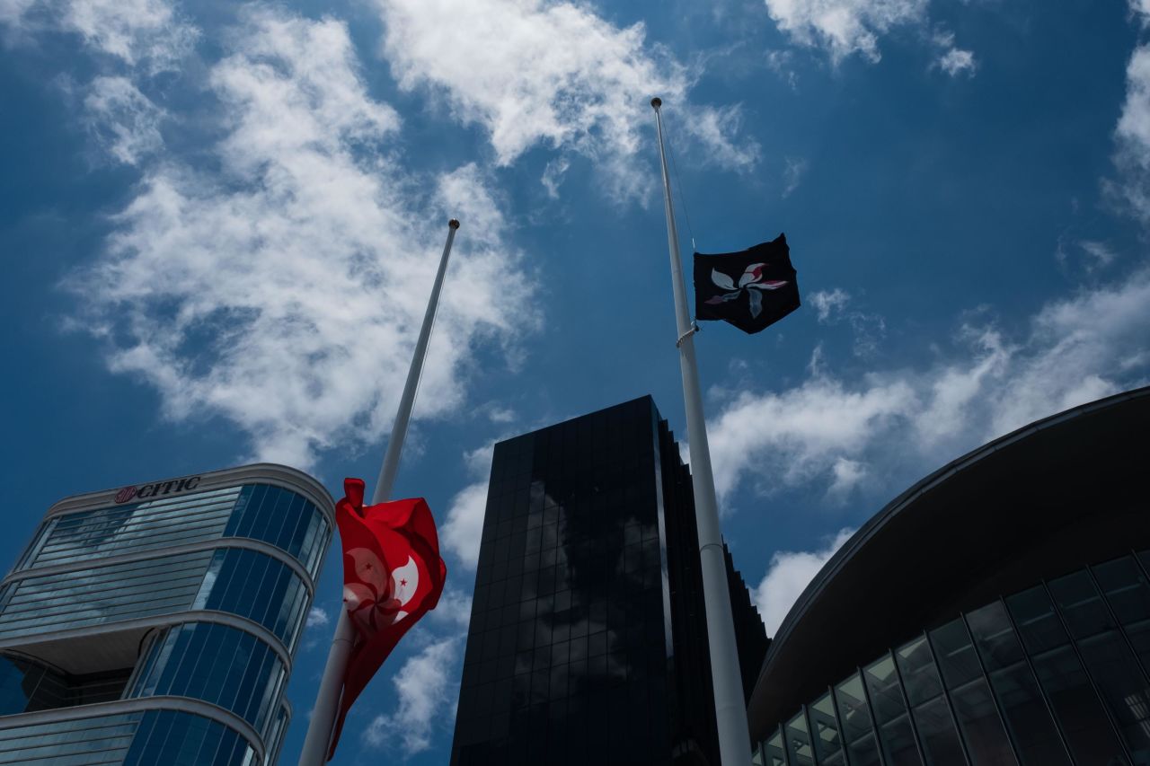Flags at half-staff outside Hong Kong's Legislative Council the day after hundreds of pro-democracy protesters broke into chamber.