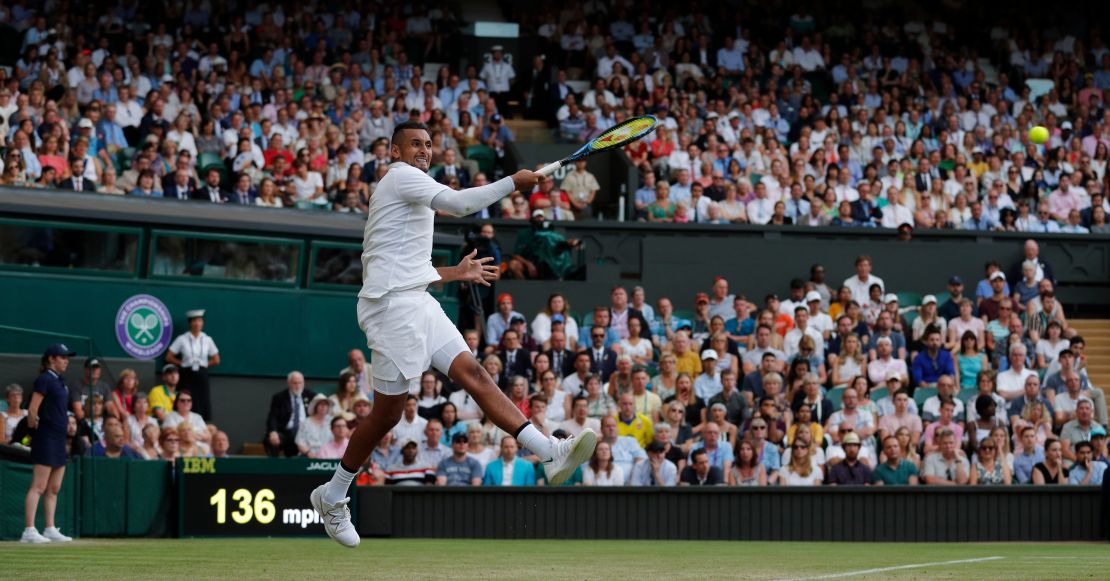 Nick Kyrgios fires a forehand against Rafael Nadal on Centre Court.  