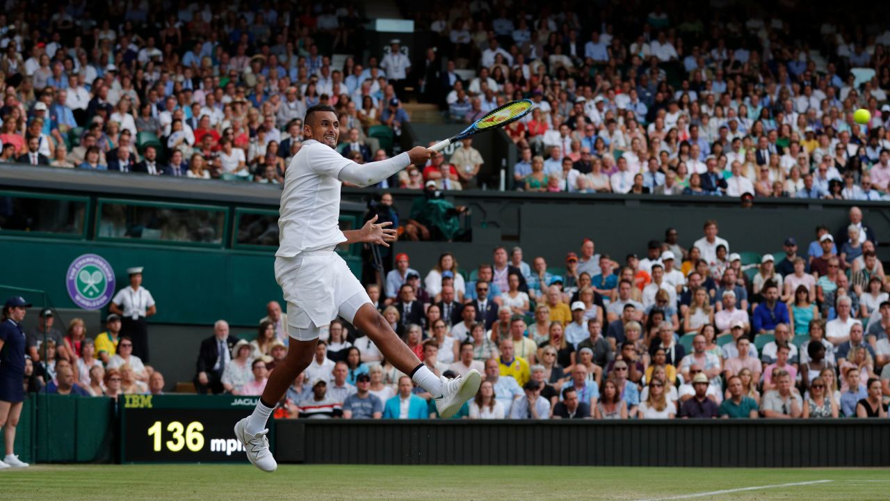 Nick Kyrgios fires a forehand against Rafael Nadal on Centre Court.  