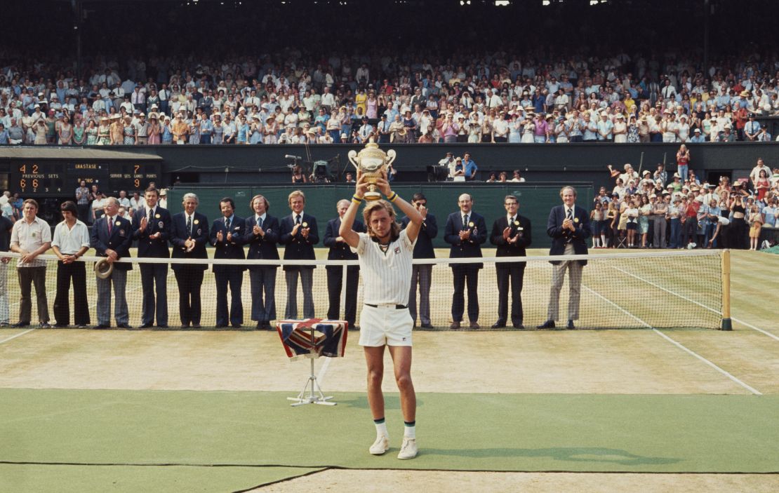 Bjorn Borg holds the trophy aloft after defeating Ilie Nastase to win Wimbledon in 1976. 