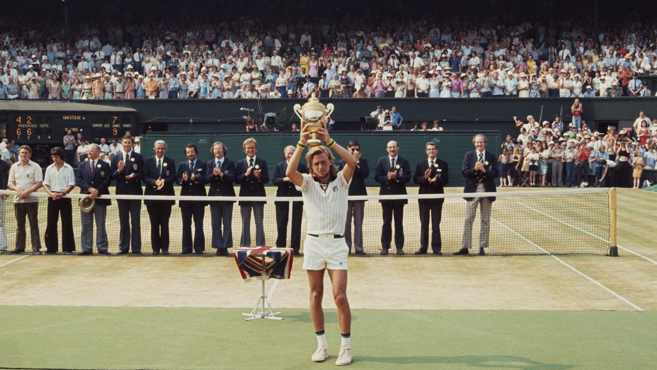 Bjorn Borg holds the trophy aloft after defeating Ilie Nastase to win Wimbledon in 1976. 