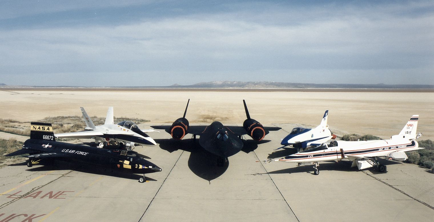 Group photo of NASA research aircraft  Left to right: mock-up of X-15, F-18B, SR-71A, X-31, and X-29.