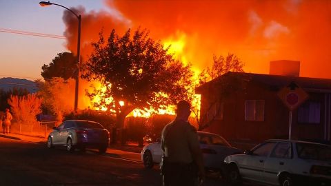 Fire engulfs a house in Ridgecrest, California, moments after an earthquake struck the area on Friday.
