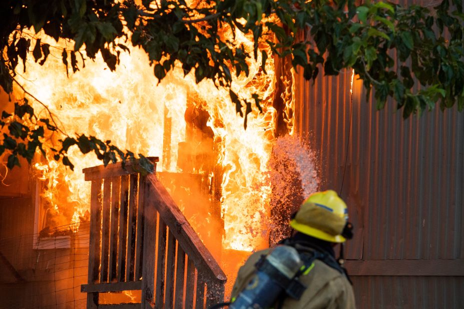 Firefighters battle an electrical fire in a mobile home park in Ridgecrest, California, following a magnitude 7.1 earthquake on July 5.