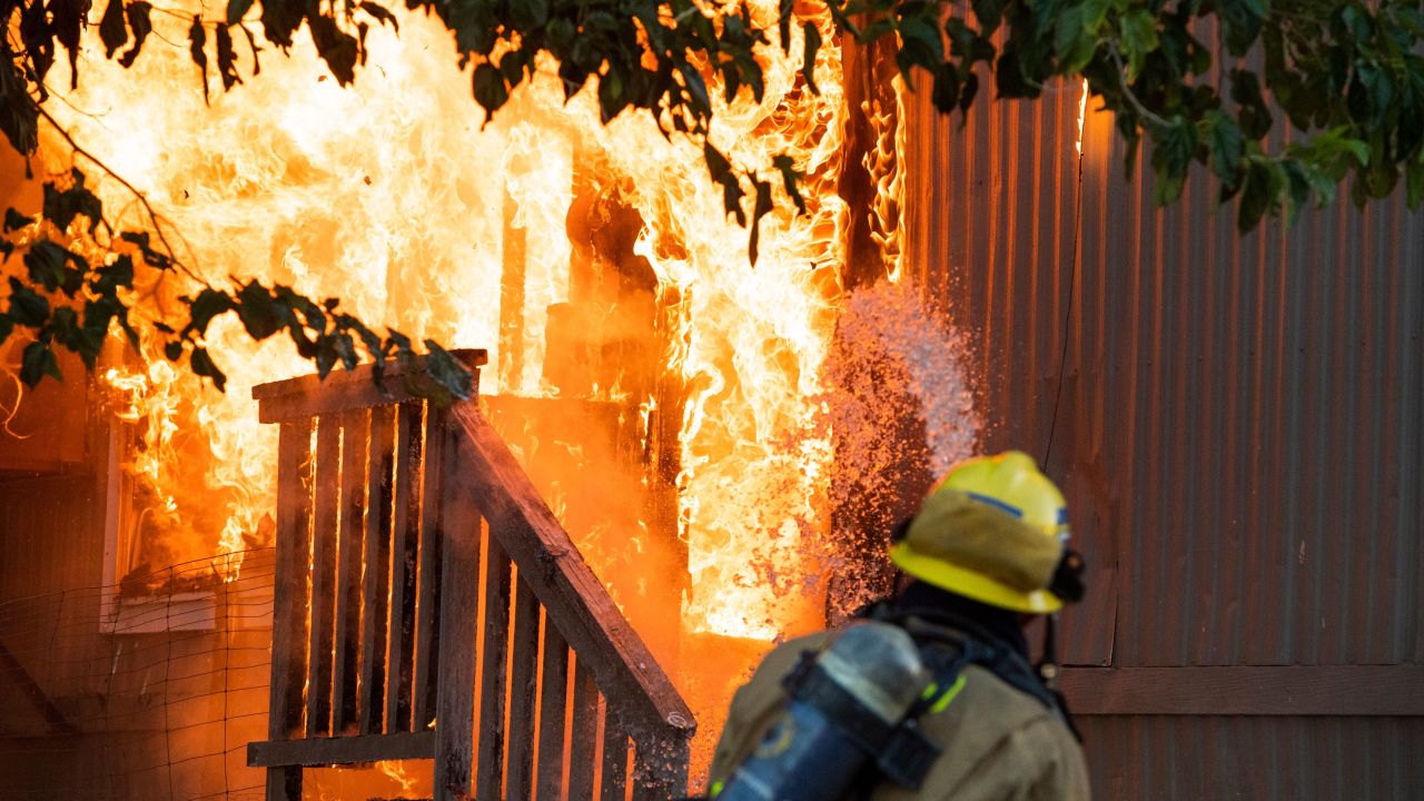 Firefighters battle a blaze Saturday in Ridgecrest after a magnitude 7.1 earthquake struck the area.