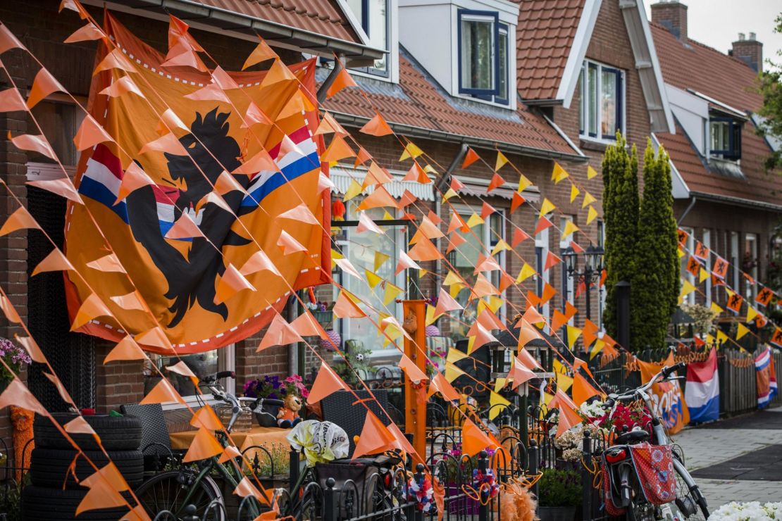 A street is decorated with banners of orange flags in Deventer, Netherlands. 