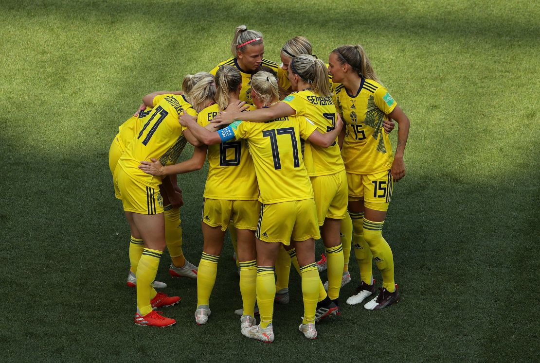 Sofia Jakobsson  celebrates with teammates after scoring Sweden's second goal.