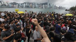 Protesters gather to take part in a march to the West Kowloon railway station.