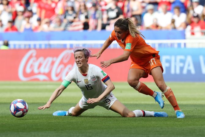 Rapinoe is challenged by Van de Donk in the first half.