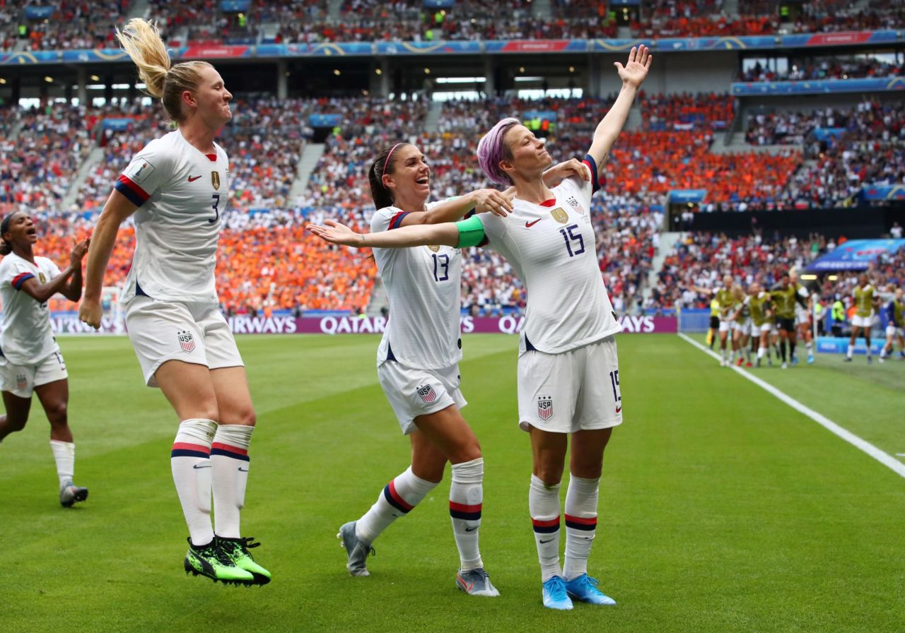 US captain Megan Rapinoe, right, celebrates with teammates after scoring the opening goal of the final. She converted a penalty in the 61st minute.