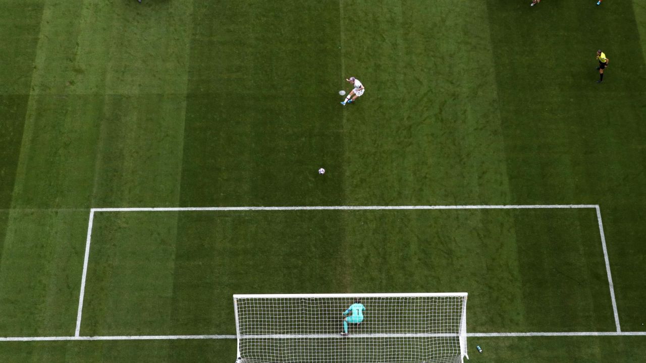 Rapinoe takes a penalty awarded in the second half for a foul on Alex Morgan.