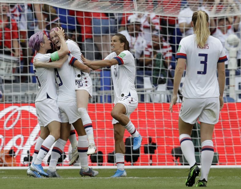 Rose Lavelle, third from left, celebrates after adding the team's second goal in the 69th minute.