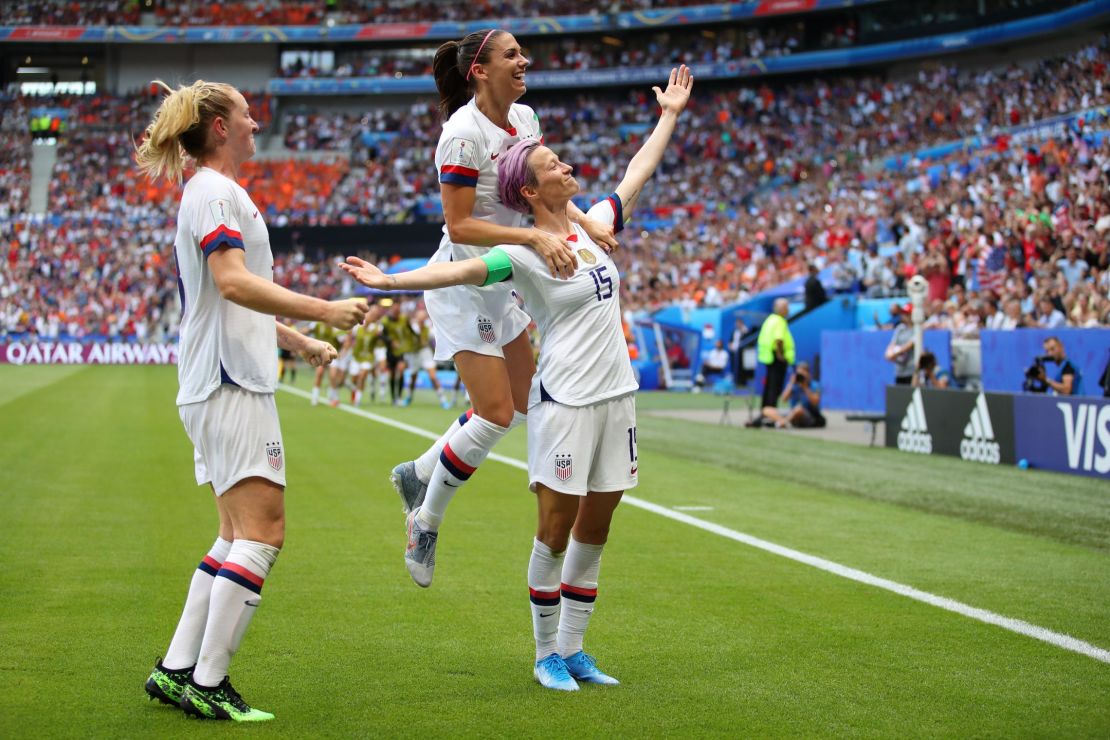 Megan Rapinoe of the US celebrates with teammates Alex Morgan and Samantha Mewis after scoring her team's first goal during the 2019 FIFA Women's World Cup France Final  yesterday at Stade de Lyon on July 7 in Lyon, France. 