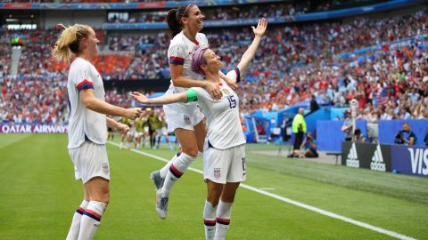 Megan Rapinoe of the US celebrates with teammates Alex Morgan and Samantha Mewis after scoring her team's first goal during the 2019 FIFA Women's World Cup France Final  yesterday at Stade de Lyon on July 7 in Lyon, France. 