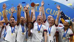 TOPSHOT - USA's players celebrate with the trophy after the France 2019 Womens World Cup football final match between USA and the Netherlands, on July 7, 2019, at the Lyon Stadium in Lyon, central-eastern France. (Photo by FRANCK FIFE / AFP)        (Photo credit should read FRANCK FIFE/AFP/Getty Images)