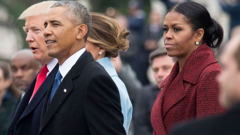 President Donald Trump (L), former President Barack Obama (C) and former First Lady Michelle Obama walk together following the inauguration, on Capitol Hill in Washington, D.C. on January 20, 2017.