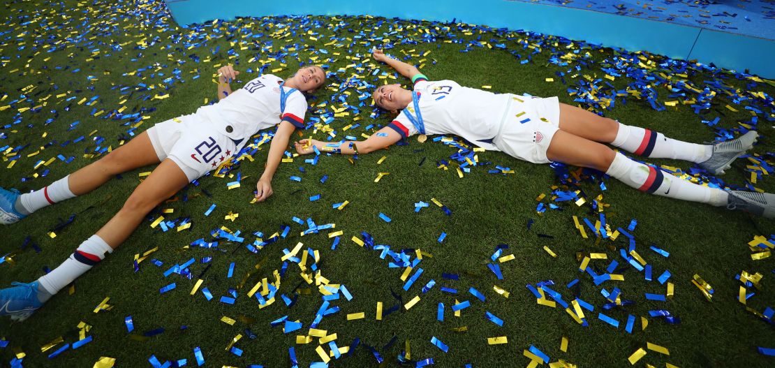 Alex Morgan and Allie Long celebrate winning the US' fourth world title. 