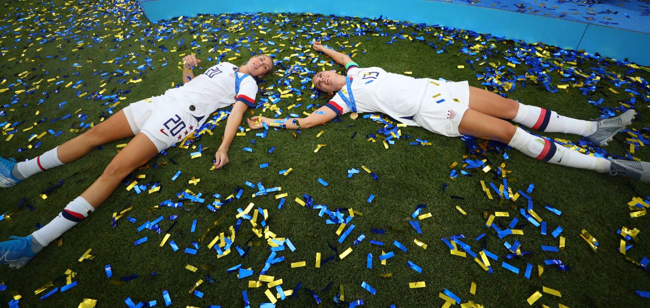 Allie Long, left, and Alex Morgan celebrate in the postgame confetti.